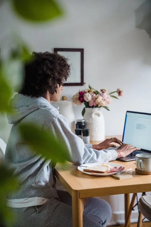 Person working at home in warm natural light